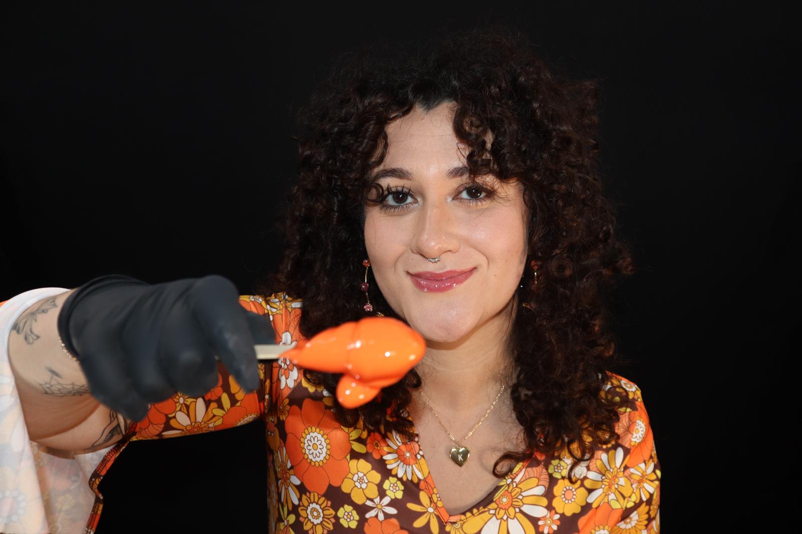 Jackiee with orange wax on stick
